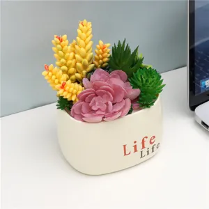 Artificial succulent potted plant with vibrant fake plants, perfect home decor and desk setup.
