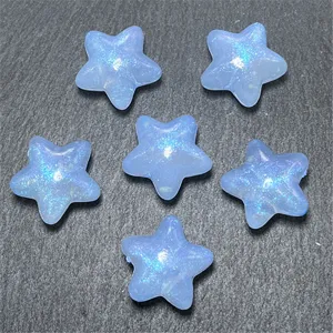 Detailed close-up of light blue mermaid style glittering star beads, perfect for DIY jewelry.