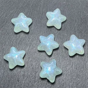 Mermaid glow star beads detail, chubby star shaped handmade DIY jewelry accessory close up.