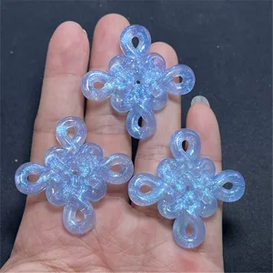 Luminous Chinese knot charm detail view, glitter resin DIY jewelry making accessory parts.