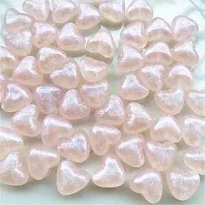 Detailed view of 10mm acrylic heart iridescent beads for DIY jewelry necklace making.