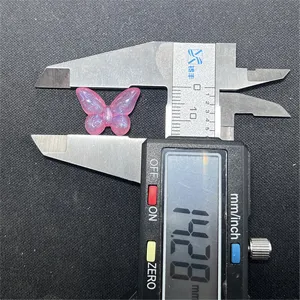 Glow-in-the-dark butterfly resin charm DIY jewelry making accessory with 14.28mm size display.