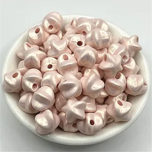 Light pink pearlescent star ABS beads with glitter finish for DIY jewelry and crafts detail view