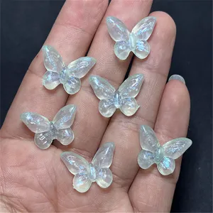 Detail shot of translucent resin butterfly charms with glitter and mermaid finish for DIY crafts.