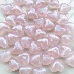 Closeup of 10mm pink mermaid iridescent acrylic heart beads detail for DIY jewelry crafts parts
