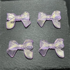 Purple translucent acrylic glitter bow charms detail, perfect for DIY jewelry and phone chains.