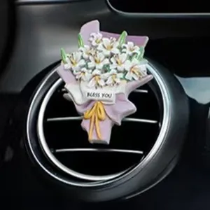 Close-up detail of a lovely flower bouquet car air vent clip, fresh and elegant floral design.
