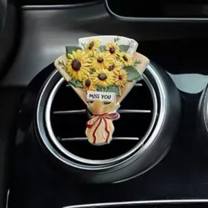 Sunflower bouquet car air vent clip aromatherapy detail, decorative interior accessory.