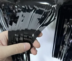 Detail view of black foil fringe curtain, perfect for party celebration photo booth backdrop.