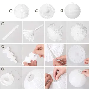White paper decoration set including pom poms, fans and lanterns for wedding party setup.
