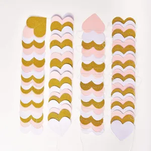 Glitter heart paper garland detail, pink gold hanging decoration for party events.