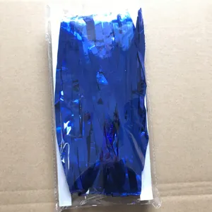 Blue tinsel fringe curtain detail, shiny foil background decoration for party and wedding.