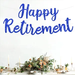 Retirement party banner detail showing blue glitter letters hanging above decorated festive table setup.