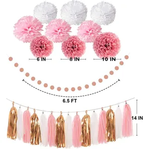 Rose gold birthday party decoration set including paper pom poms, dot garland and tassels.