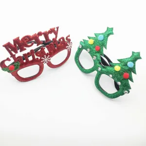 Close-up detail of Christmas novelty glasses, glitter red and green tree festive styles.