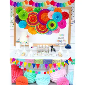Colorful paper fan pom poms banner set for birthday party decorations and festive backdrop.