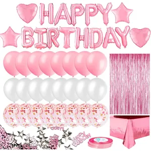 Detailed view of rose gold birthday party decoration set with letter balloons and tinsel curtain.
