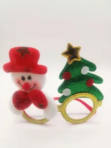 Christmas theme snowman and tree decorative glasses detail showing fuzzy texture and gold glitter.