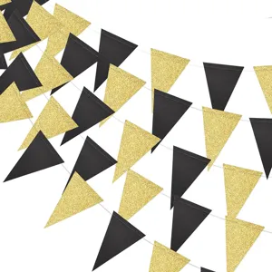 Black and gold glitter triangle bunting garland closeup for graduation party decor.