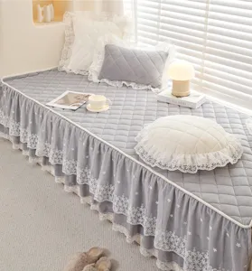 Grey quilted bay window cushion featuring elegant double lace ruffle skirts for cozy decor.