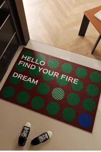 Detailed view of mid-century modern entrance doormat with stylish polka dots and English text.