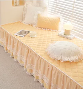 Quilted bay window mat with elegant lace trim, comfortable seasonal balcony cushion cover.