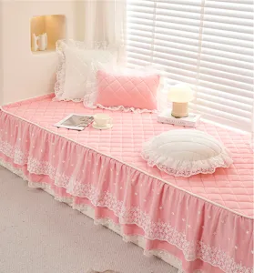 Pink quilted bay window cushion with elegant white lace ruffles and matching pillows for home decor.