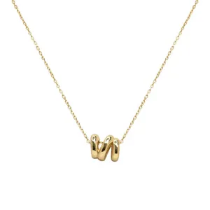 Gold-plated irregular wave pendant necklace detail shot, elegant geometric design.