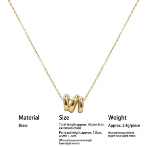 Gold-plated brass irregular geometric wave pendant necklace with delicate chain.
