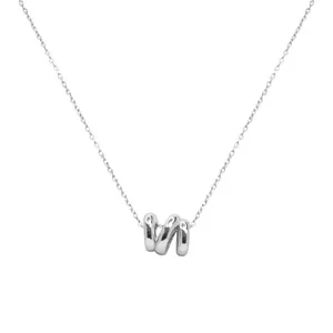 Close-up view of the silver irregular wave pendant necklace showing fine metal texture.