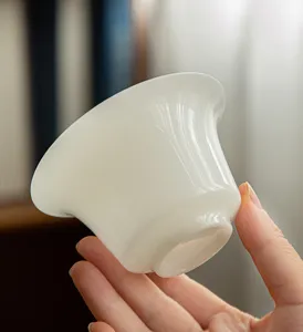 Detailed view of a white porcelain tea cup, elegant ceramic teacup for gongfu tea ceremony.