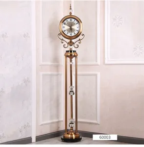 Luxury European style standing floor clock detail, elegant golden metal and crystal design.