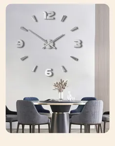 Detailed view of DIY wall clock with silver 3D mirror numbers and minimalist hands in modern room.