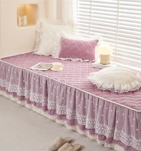 Quilted velvet bay window cushion with elegant lace ruffles, cozy seasonal home decor mat.