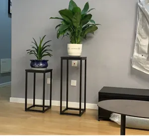 Modern metal plant stand for indoor balcony potted plants, minimalist iron display shelf.