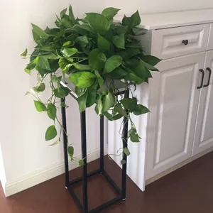Modern black iron plant stand, floor-standing flower pot holder for indoor home balcony decor.