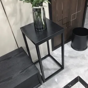 Detailed view of the modern black metal plant stand, perfect for indoor home decor and balcony pots.