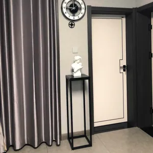 Modern minimalist black iron plant stand floor standing flower pot holder for indoor balcony decor.