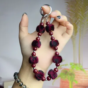 Vintage maroon plush ball beaded phone chain elegant bag charm keychain for women.