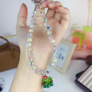 Crystal beaded phone charm with Christmas tree pendant, sparkling accessory for bag and phone.