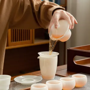 Elegant ceramic tea set with gaiwan and cups, ideal for traditional kung fu tea brewing at home.