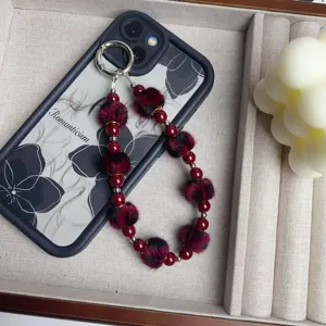 Wine red furry ball beaded phone charm and bag pendant, elegant vintage style accessory.