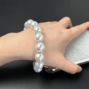 Pearl phone charm bracelet with sparkling rhinestone spacers for women accessories.