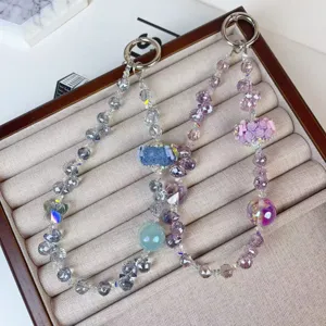 Crystal beaded phone chain and bag charm featuring charming rose flower balls and sparkling beads.