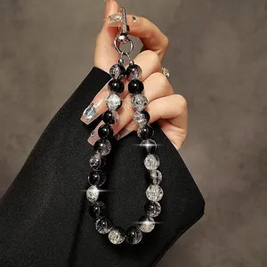 Black cracked beaded wrist strap chain for phone case, creative short lanyard bag charm.