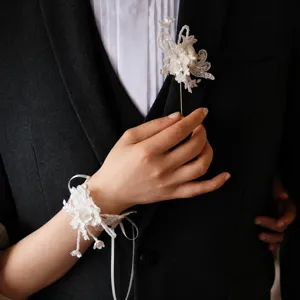Elegant white lace wedding wrist flower and brooch set for bride and groom accessories.