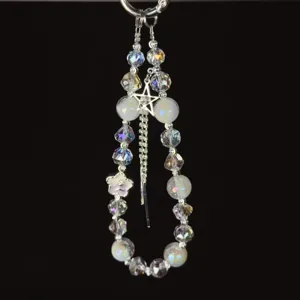 Detailed view of the Korean style crystal beaded phone charm with sparkling rhinestone tassel.