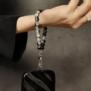 Stylish black cracked bead phone wrist strap lanyard with tether tab for case and bag charm.