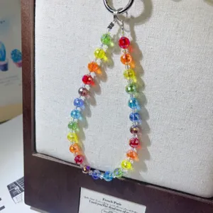 Detailed view of handmade crystal beaded phone charm strap with colorful 96-facet beads.