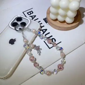 Pink crystal beaded phone charm with star pendant cute aesthetic phone strap accessory for women.